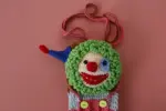 Hand-crocheted clown phone bag