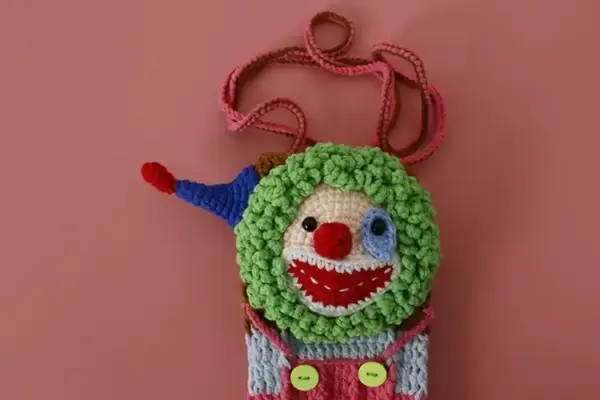 Hand-crocheted clown phone bag