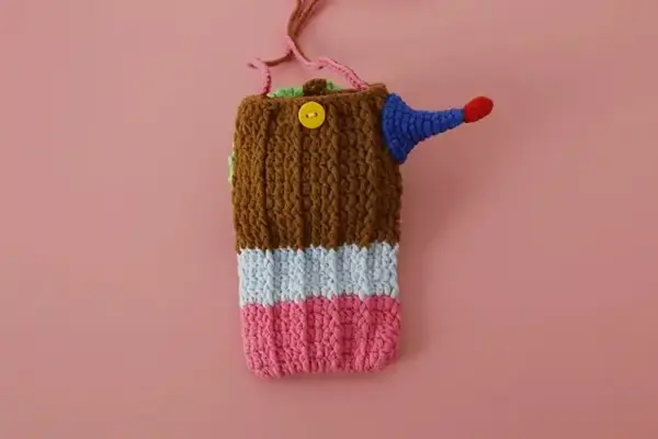 Hand-crocheted clown phone bag