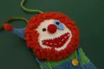 Hand-crocheted clown phone bag