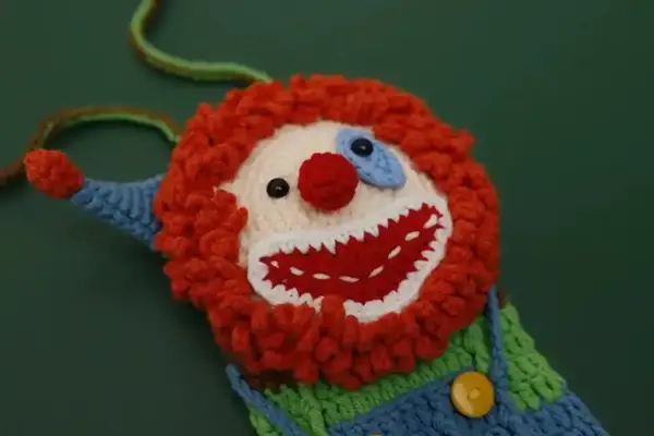 Hand-crocheted clown phone bag
